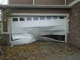 Garage door with crushed lower panels